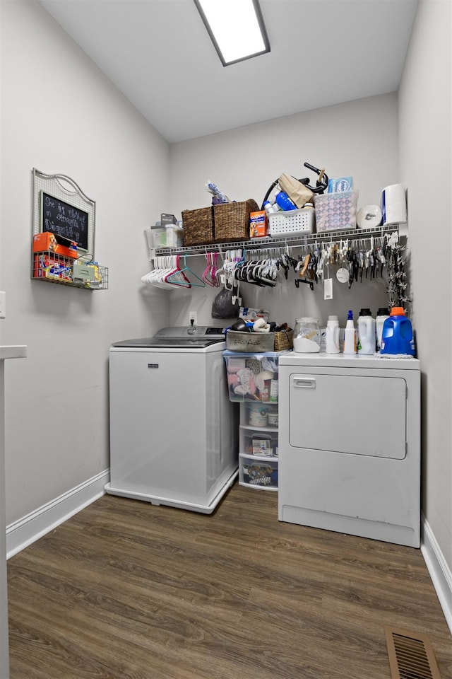3914 Dogwood Valley Rd, Tunnel Hill, GA 30755 - clothes washing area featuring wood finished floors, washing machine and dryer, laundry area, and visible vents