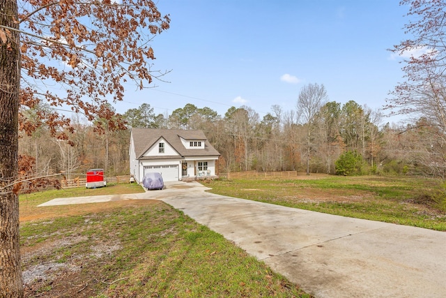 3914 Dogwood Valley Rd, Tunnel Hill, GA 30755 - view of front facade with a front yard, a wooded view, concrete driveway, and fence