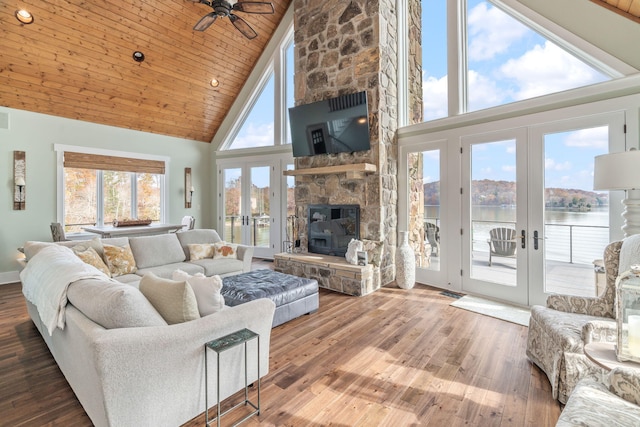 living room featuring hardwood / wood-style floors, wood ceiling, french doors, and high vaulted ceiling