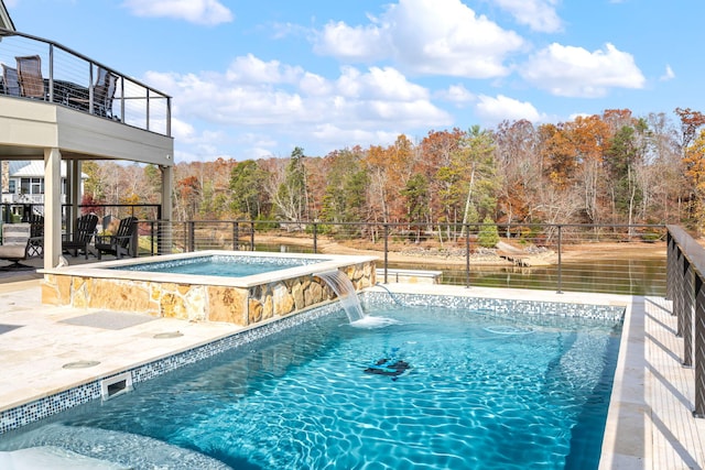 view of pool with pool water feature and an in ground hot tub