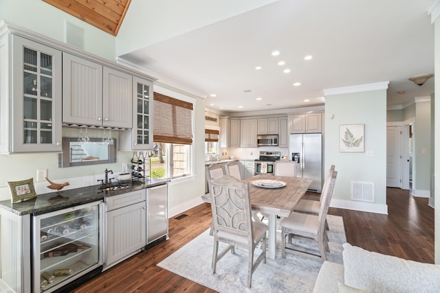 kitchen featuring wine cooler, sink, gray cabinetry, stainless steel appliances, and ornamental molding