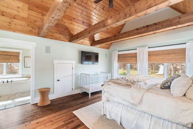 bedroom featuring wood ceiling, ceiling fan, connected bathroom, dark hardwood / wood-style floors, and vaulted ceiling with beams