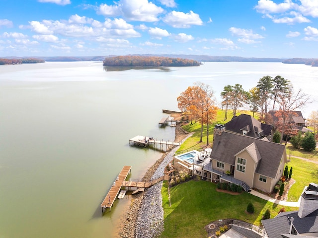 drone / aerial view with a water view