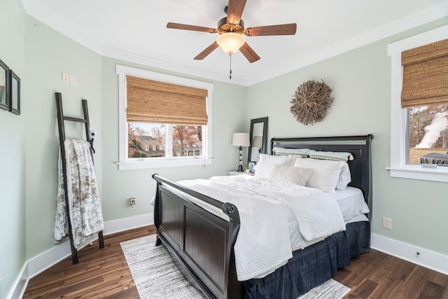 bedroom featuring ceiling fan, dark hardwood / wood-style floors, and ornamental molding