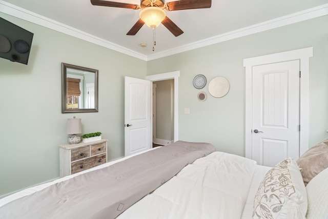 bedroom featuring ceiling fan and crown molding