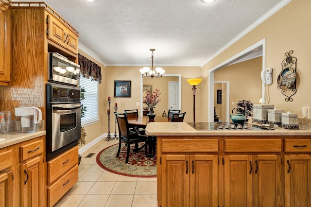 135 Charles Cir SE, Cleveland, TN 37323 - kitchen featuring appliances with stainless steel finishes, light tile patterned floors, a chandelier, brown cabinetry, and ornamental molding