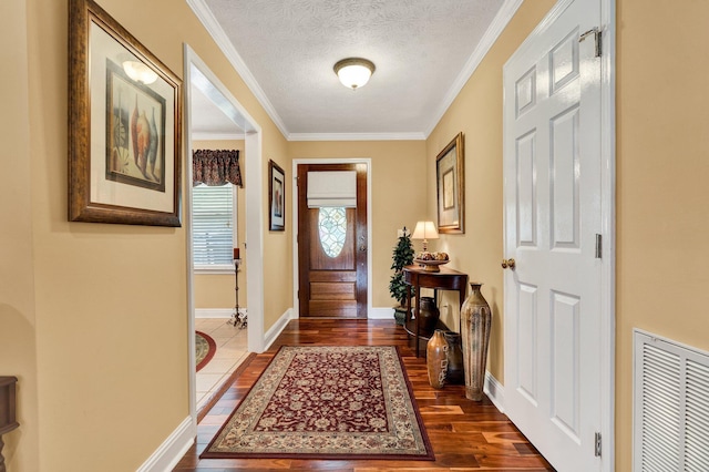 135 Charles Cir SE, Cleveland, TN 37323 - foyer featuring dark wood finished floors, crown molding, and a textured ceiling