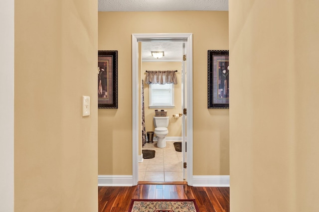 135 Charles Cir SE, Cleveland, TN 37323 - hall featuring dark wood-style flooring and a textured ceiling