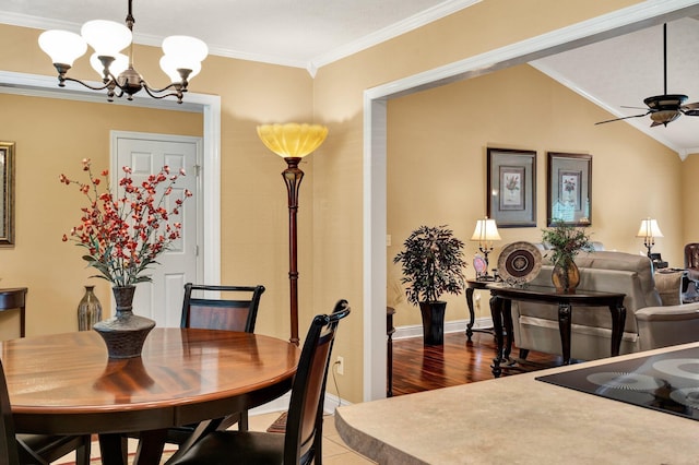 135 Charles Cir SE, Cleveland, TN 37323 - dining space with a chandelier, ornamental molding, ceiling fan, and tile patterned floors