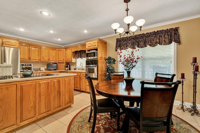 135 Charles Cir SE, Cleveland, TN 37323 - dining space with light tile patterned floors, a chandelier, crown molding, and recessed lighting
