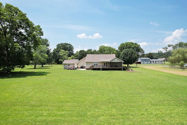 135 Charles Cir SE, Cleveland, TN 37323 - view of green lawn with a deck and view of wooded area