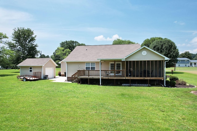 135 Charles Cir SE, Cleveland, TN 37323 - back of property with an outdoor structure, a detached garage, a sunroom, and a lawn
