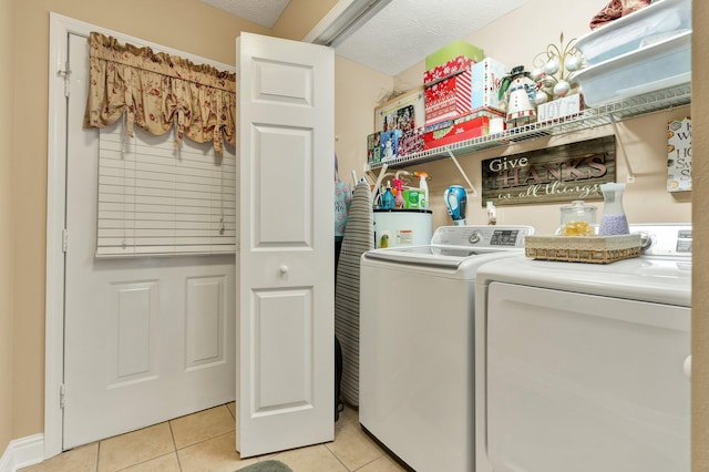 135 Charles Cir SE, Cleveland, TN 37323 - laundry room featuring washer and dryer, light tile patterned floors, and water heater