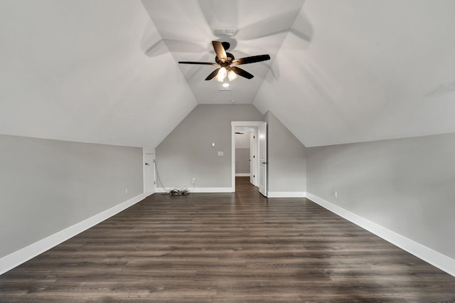 additional living space featuring ceiling fan, lofted ceiling, and dark wood-type flooring