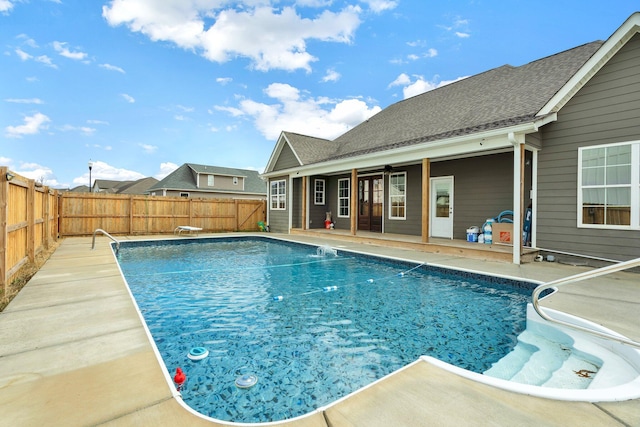 view of swimming pool featuring ceiling fan and a patio