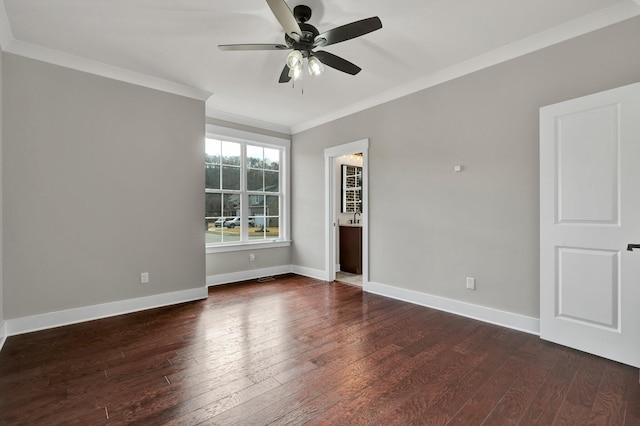 spare room with dark hardwood / wood-style flooring, ceiling fan, and crown molding