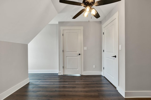 bonus room with ceiling fan and dark hardwood / wood-style flooring