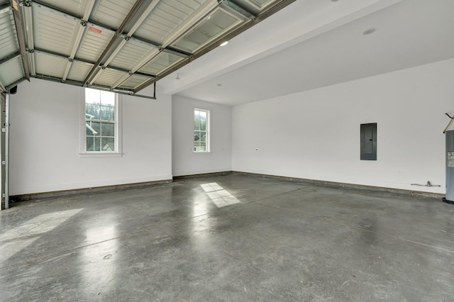 garage with electric panel and water heater