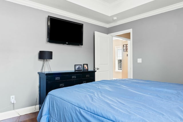 bedroom featuring baseboards and ornamental molding