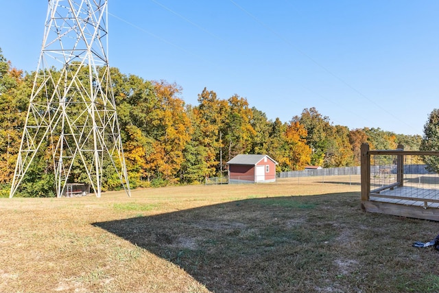 view of yard with a wooden deck and fence