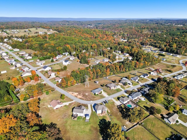 aerial view with a residential view and a wooded view