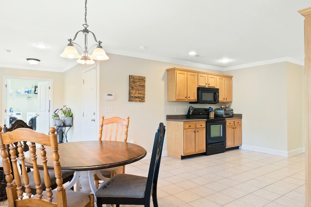 kitchen with black appliances, light brown cabinets, dark countertops, crown molding, and washing machine and clothes dryer