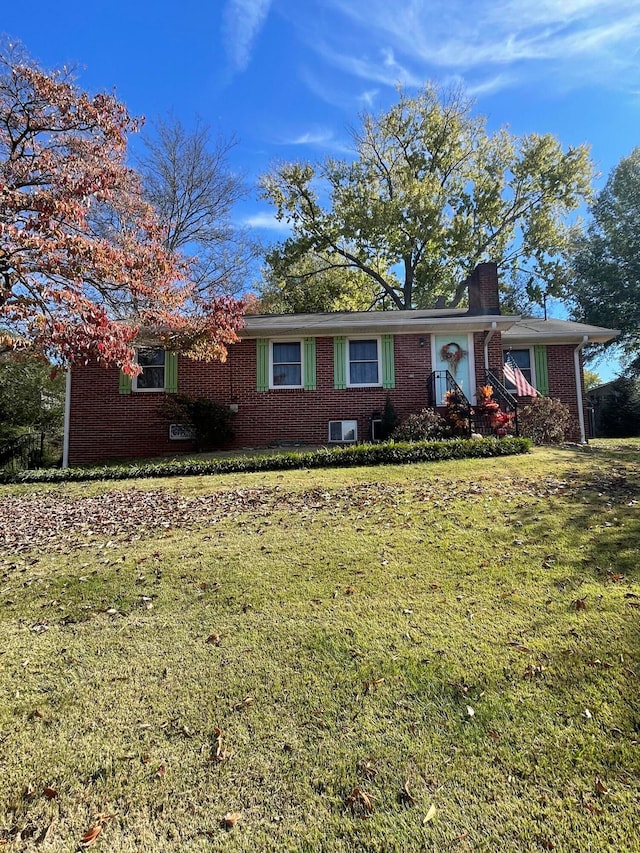 ranch-style house with a front lawn