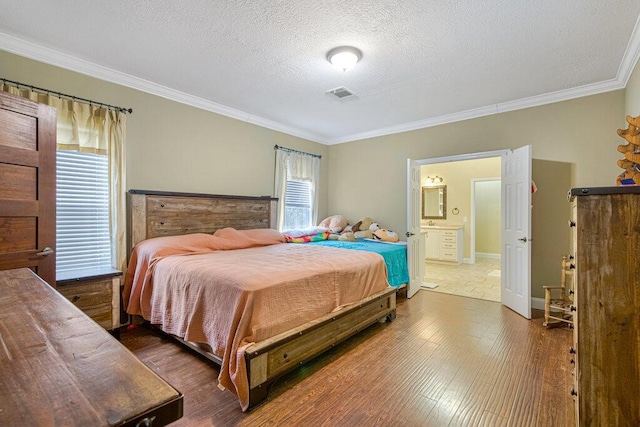 bedroom featuring crown molding, dark hardwood / wood-style floors, and a textured ceiling