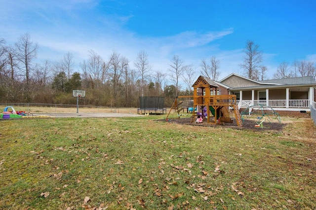 view of yard with a playground, a porch, and a trampoline