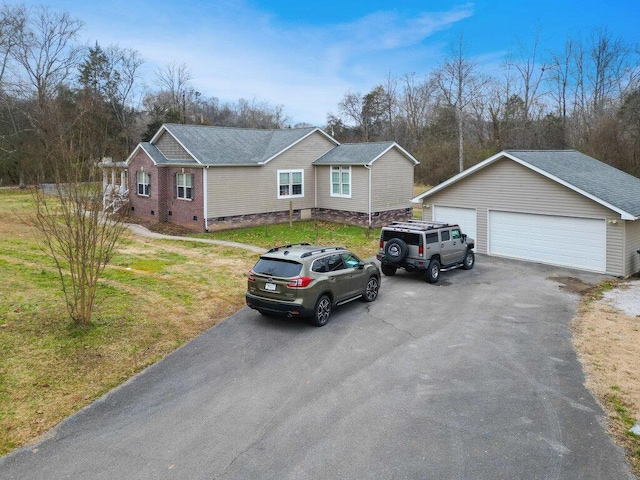 view of front of home with a garage and a front yard