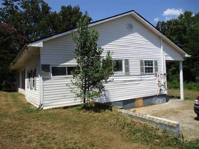 view of property exterior featuring a yard