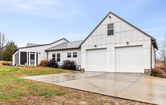 view of front of house with a garage and a front yard