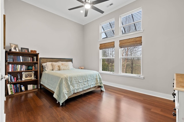 bedroom featuring ceiling fan and dark wood-type flooring