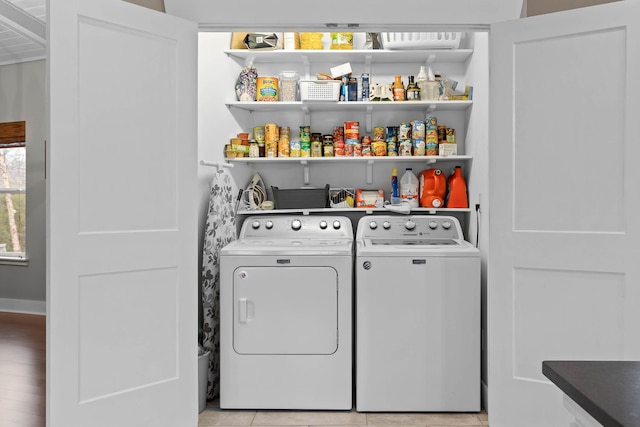 laundry room with independent washer and dryer