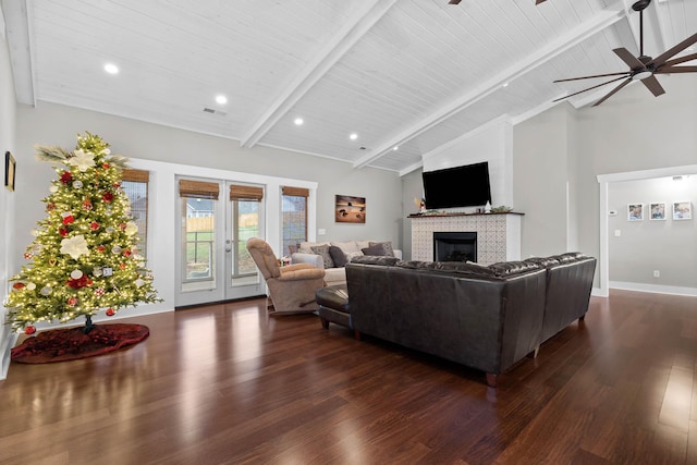 living room with dark wood-type flooring, wood ceiling, beam ceiling, and french doors