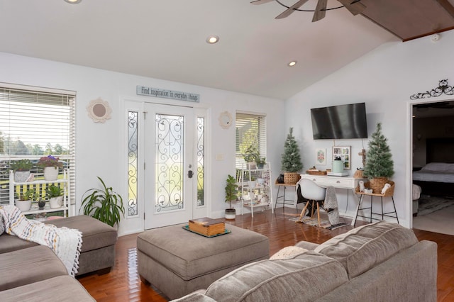 living room with dark hardwood / wood-style flooring, ceiling fan, and lofted ceiling