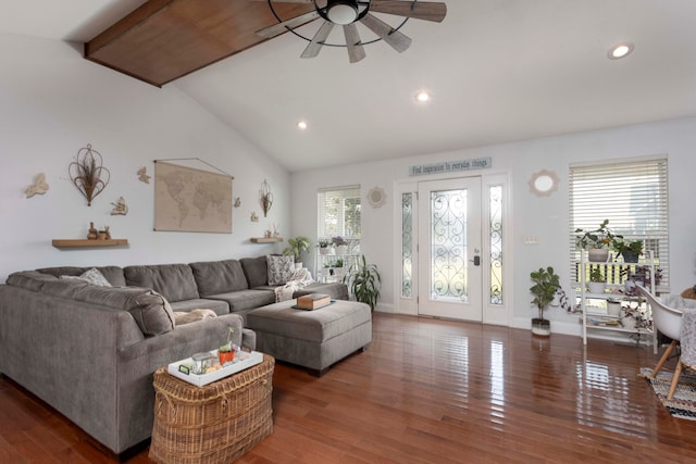 living room with ceiling fan, a healthy amount of sunlight, lofted ceiling, and dark wood-type flooring