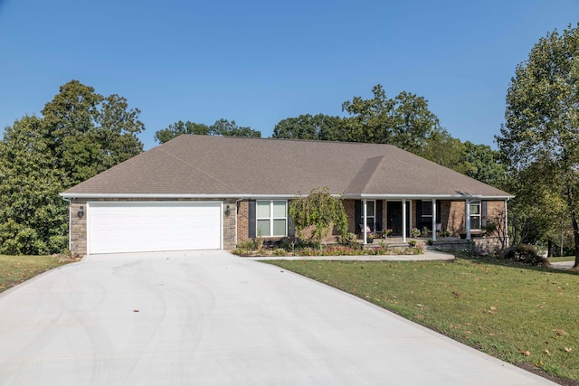 ranch-style home featuring a garage and a front lawn