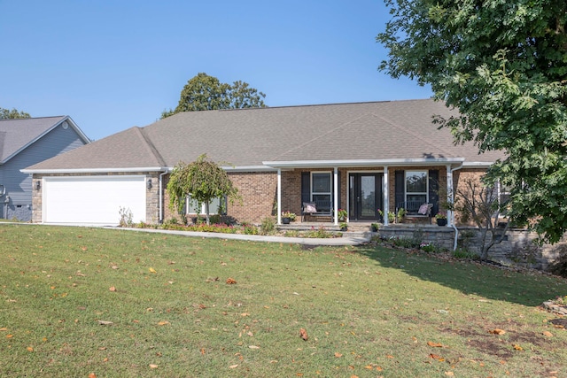 ranch-style home featuring a porch, a garage, and a front lawn