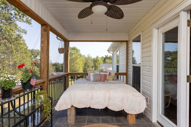 exterior space with ceiling fan