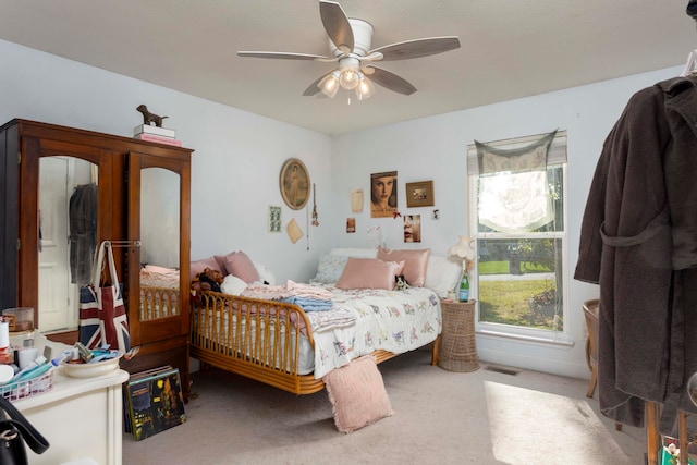 carpeted bedroom featuring ceiling fan