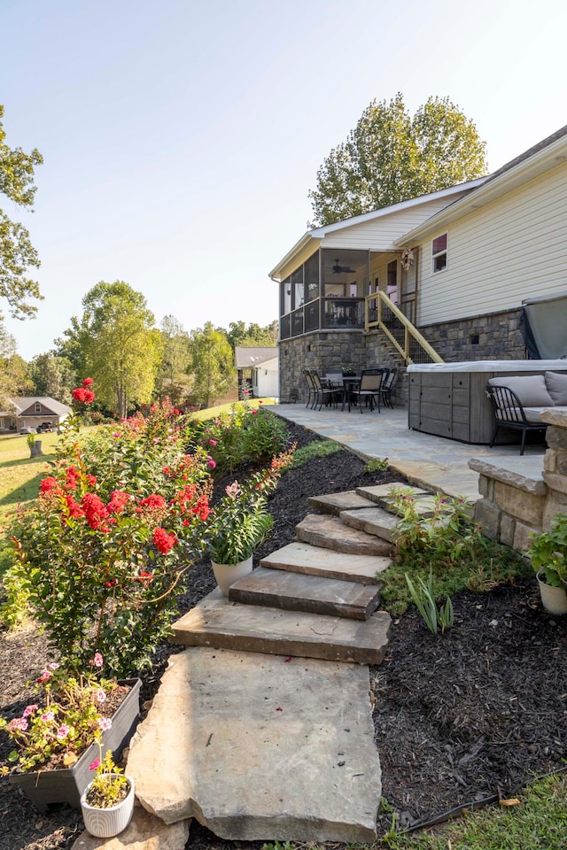 view of yard with a patio area, ceiling fan, and a sunroom