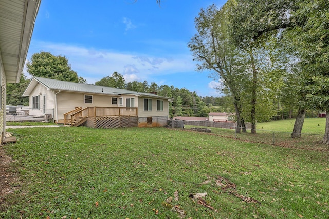 view of yard with a wooden deck