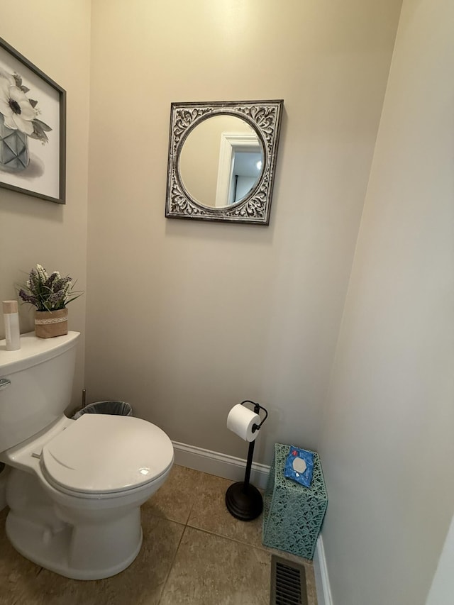 bathroom featuring tile patterned flooring and toilet