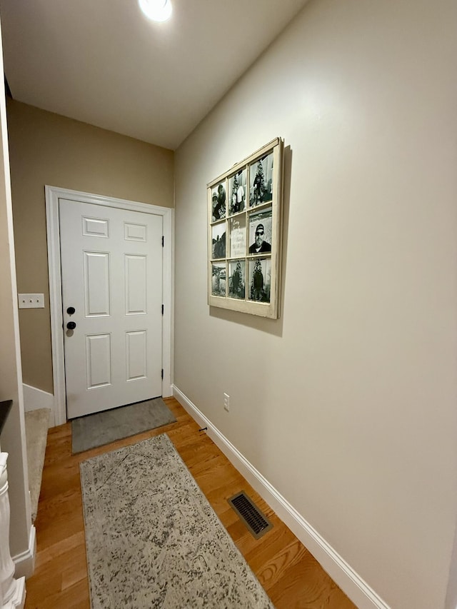 doorway to outside with light wood-type flooring