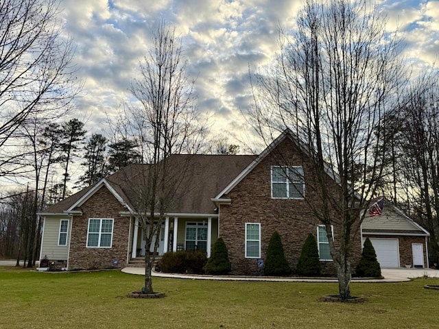 view of front of home with a garage and a front yard