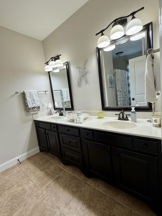 bathroom with tile patterned flooring, vanity, and curtained shower