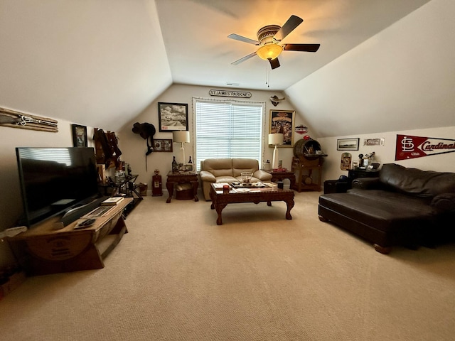 carpeted living room featuring vaulted ceiling and ceiling fan