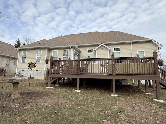 rear view of house with a wooden deck