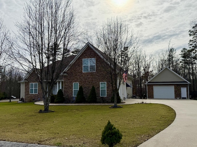 view of front of property featuring a garage and a front yard